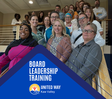Board Leadership Training participants pose for a group photo on a staircase.